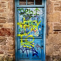 Buy canvas prints of Graffitied door  by Christopher Marchant