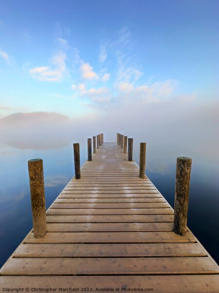 A jetty leading into the foggy lake Ullswater  Picture Board by Christopher Marchant