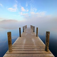 Buy canvas prints of A jetty leading into the foggy lake Ullswater  by Christopher Marchant