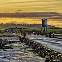 Buy canvas prints of The Lindisfarne Causeway at dusk by Robert Mowat