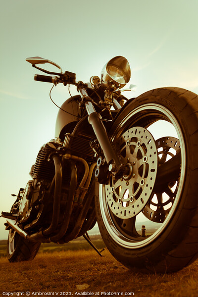 A two tone close up shot of the front tyre of a custom made motorbike, chopper Picture Board by Ambrosini V