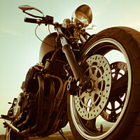 Buy canvas prints of A two tone close up shot of the front tyre of a custom made motorbike, chopper by Ambrosini V