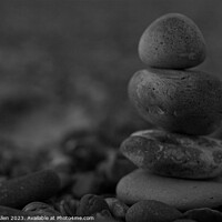 Buy canvas prints of Stacked up Beach Stones  by James Allen