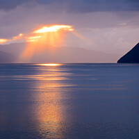 Buy canvas prints of A sunburst over a Norwegian fjord by Iain Lockhart