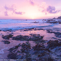 Buy canvas prints of Serene Sunset Symphony: A Pink Horizon over Rocky Shores