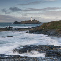 Buy canvas prints of Guardian of the Tides: Godrevy's Dance with the Approaching Stor by Andy Durnin