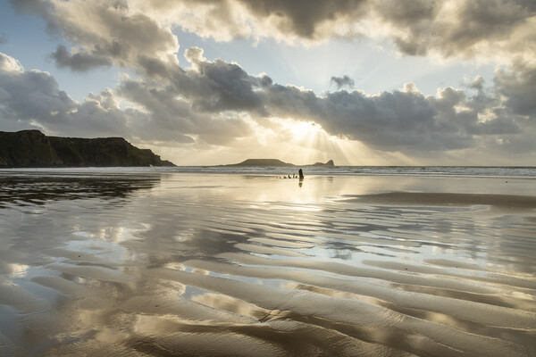 Sunbeams over Rhossili Bay Picture Board by Robert Canis