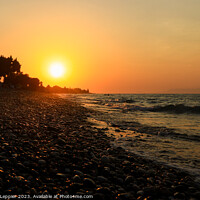 Buy canvas prints of Rhodes Beach Sunset and Pebbles by Michele Leppier