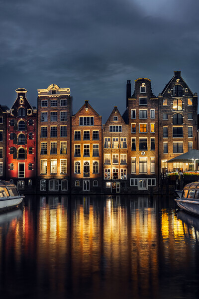 Night dancing houses at Amsterdam canal Damrak, Holland, Netherl Picture Board by Olga Peddi
