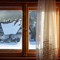 Buy canvas prints of Beautiful view from window on winter village with  by Olga Peddi