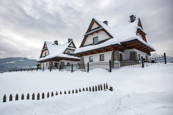 Wooden house under heavy snow, Zakopane, Poland. Picture Board by Olga Peddi