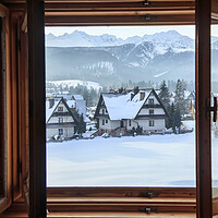 Buy canvas prints of Beautiful view from an open window to a winter vil by Olga Peddi