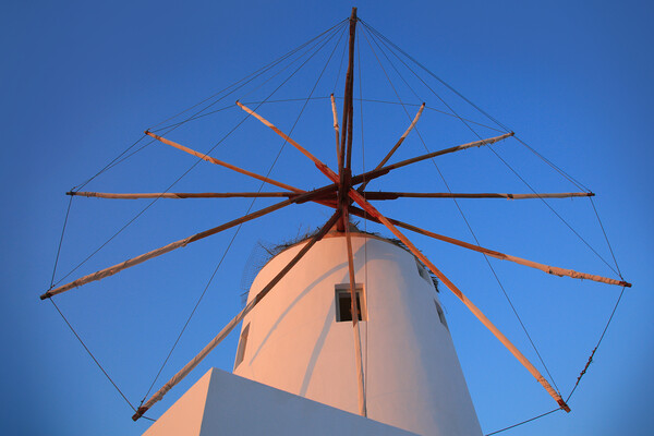 Santorini windmill with the bleu sky Picture Board by Olga Peddi