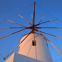 Buy canvas prints of Santorini windmill with the bleu sky by Olga Peddi