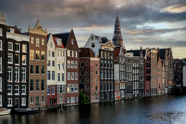 Houses along an Amsterdam canal. Summer cloudy day Picture Board by Olga Peddi