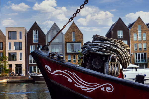 Boat on channel in Haarlem - Holland. Picture Board by Olga Peddi
