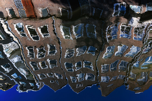 Colourful reflection of a city in a water. Amsterd Picture Board by Olga Peddi