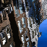 Buy canvas prints of Colourful reflection of a city in a water. Amsterd by Olga Peddi