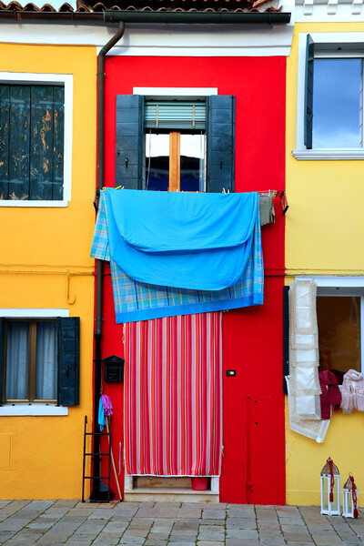 Beautiful colorful houses of Burano, Venice, Italy Picture Board by Olga Peddi