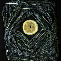 Buy canvas prints of Green Kale leaves end lemon slices  by Olga Peddi