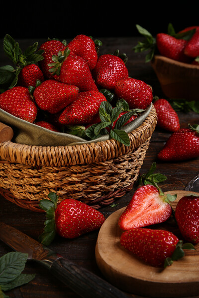 Fresh strawberries in a basket  Picture Board by Olga Peddi