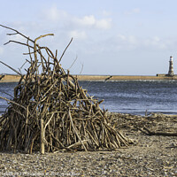 Buy canvas prints of Driftwood stack on Roker beach  by Bryan Attewell