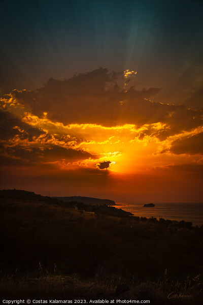 Sunrise behind the clouds Picture Board by Costas Kalamaras