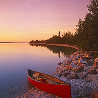 Buy canvas prints of canoe along shoreline by Dave Reede