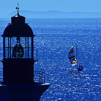Buy canvas prints of lighthouse and sailboat by Dave Reede