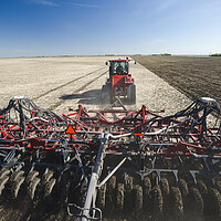 Buy canvas prints of moving tractor and and air till seeder planting soybeans by Dave Reede