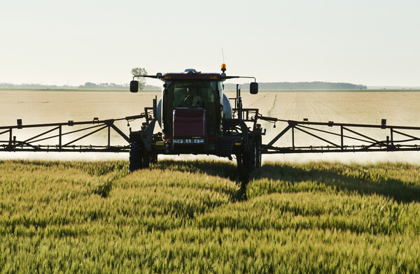 spraying barley Picture Board by Dave Reede