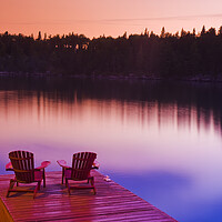 Buy canvas prints of Muskoka chairs on dock by Dave Reede