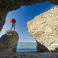 Buy canvas prints of Hiker Along Cliffs by Dave Reede