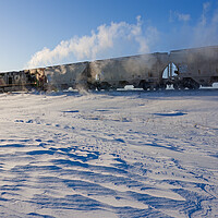 Buy canvas prints of train crossing the prairies in winter by Dave Reede