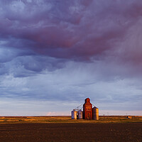Buy canvas prints of abandoned grain elevator and cumulonimbus cloud by Dave Reede