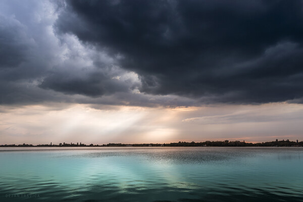 Turquoise lake under the cloudy sky Picture Board by Dejan Travica