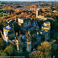 Buy canvas prints of Aerial view of the Lancaster Castle amidst lush trees during sunset, with a panoramic backdrop of a quaint town. by Man And Life