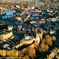 Buy canvas prints of Aerial view of a historic city Lancaster at sunset with prominent castle and urban landscape. by Man And Life