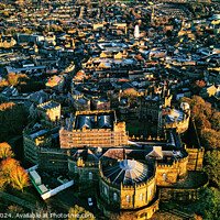 Buy canvas prints of Aerial view of a historic city Lancaster at sunset with warm lighting highlighting architectural details and dense urban landscape. by Man And Life