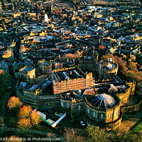 Buy canvas prints of Aerial view of a historic Lancaster castle amidst a sprawling cityscape during golden hour, showcasing architectural beauty and urban density. by Man And Life