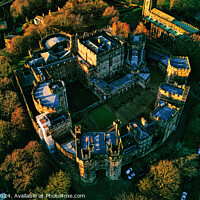 Buy canvas prints of Aerial view of a majestic Lancaster castle surrounded by lush trees during golden hour, showcasing the historic architecture and scenic landscape. by Man And Life