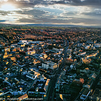Buy canvas prints of Aerial view of the Lancaster city at sunset with warm light casting over buildings and streets, showcasing urban landscape and architecture. by Man And Life