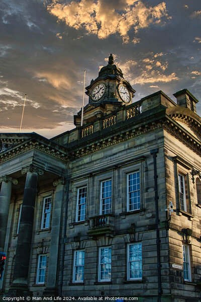 Historic building with clock tower against a dramatic sunset sky in Lancaster. Picture Board by Man And Life