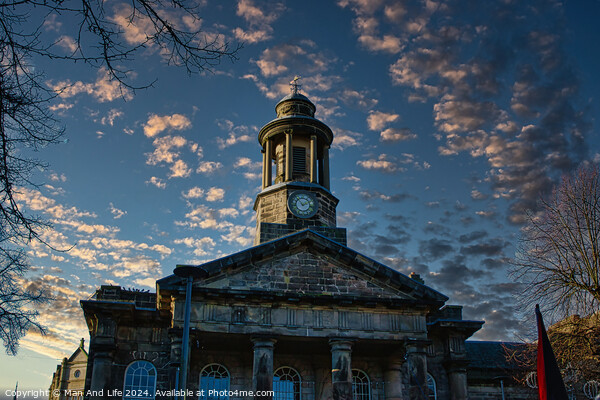 Historic stone building with clock tower against a dramatic sky at sunset in Lancaster. Picture Board by Man And Life