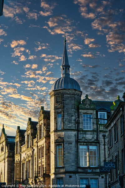 Historic building with a spire against a dramatic sky with golden sunset clouds in Lancaster. Picture Board by Man And Life