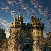 Buy canvas prints of Historic stone castle with towers against a blue sky with scattered clouds at sunset in Lancaster. by Man And Life