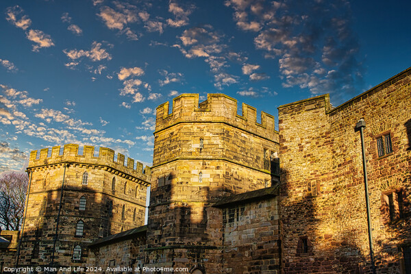 Medieval stone castle at sunset with picturesque clouds in the sky in Lancaster. Picture Board by Man And Life
