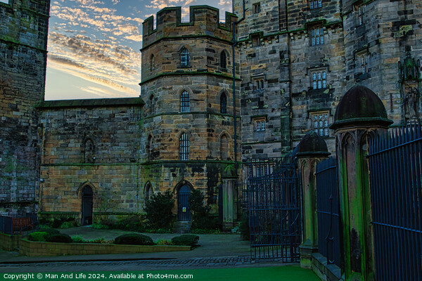 Historic stone castle at dusk with dramatic sky and greenery, suitable for travel and history themes in Lancaster. Picture Board by Man And Life