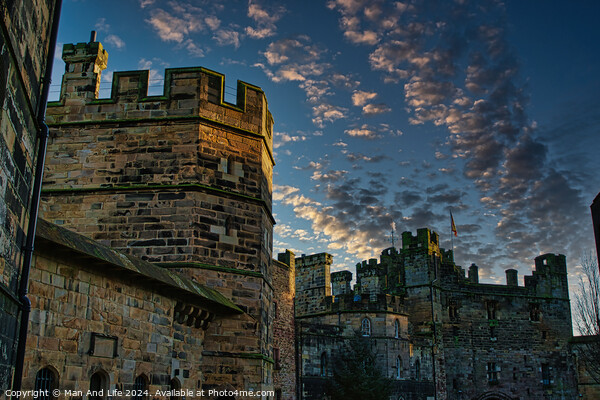 Medieval castle at dusk with dramatic sky and clouds in Lancaster. Picture Board by Man And Life