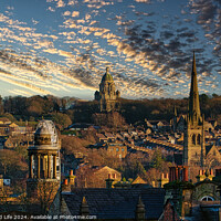 Buy canvas prints of Historic cityscape at sunset with dramatic clouds, showcasing architectural landmarks and a warm golden light bathing the buildings in Lancaster. by Man And Life